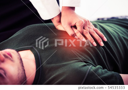Rescuer hands doing CPR on heart attacked man. Rescuer hands doing CPR on heart attacked man. 54535333