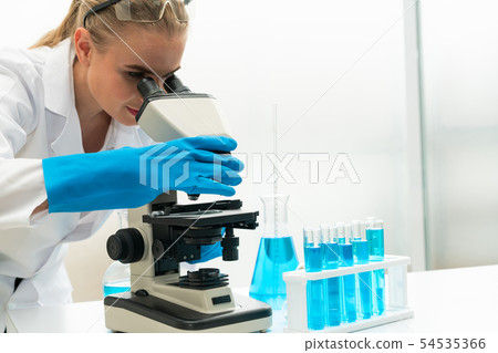 Woman scientist working in chemist laboratory. 54535366