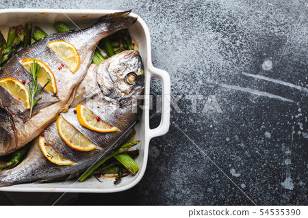 Fish dorado baked with asparagus Fish dorado baked with asparagus 54535390