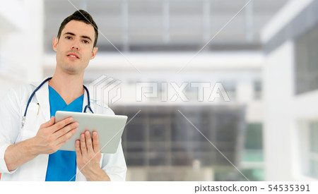 Doctor using tablet computer at the hospital. 54535391
