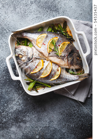 Fish dorado baked with asparagus Fish dorado baked with asparagus 54535437