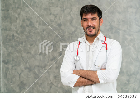 Young male doctor working at the hospital. 54535538