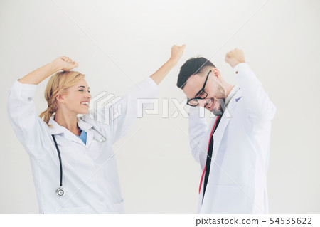 Happy doctor celebrates success with partner. Happy doctor celebrates success with partner. 54535622