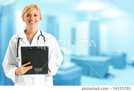 Woman doctor working at the hospital office. 54535783