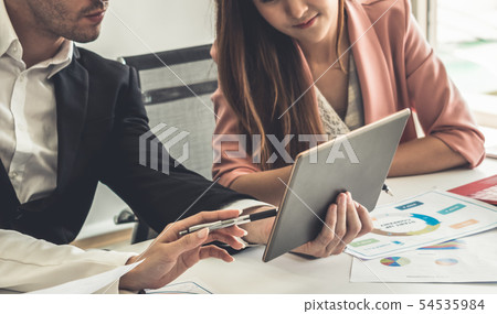 Businessman and businesswomen working in office. 54535984