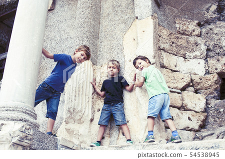 little boy exploring ancient architecture, lifestyle people on summer vacation close up little boy exploring ancient architecture, lifestyle people on summer vacation close up 54538945