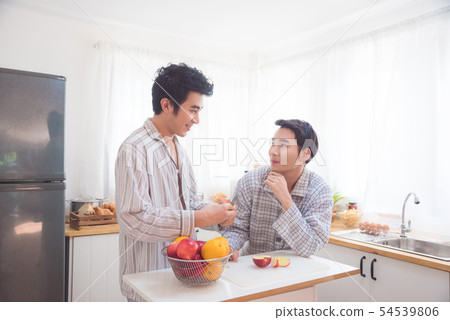 Young male homosexual couple in kitchen Young male homosexual couple in kitchen 54539806