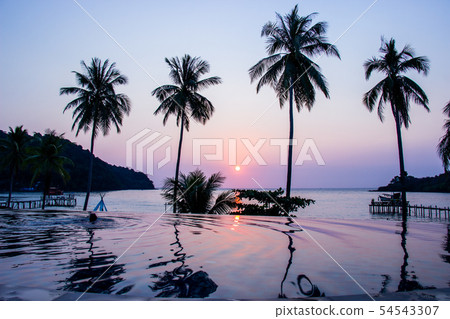 Sunset reflecting on the water surface foreground. 54543307