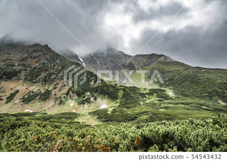 Volcanic landscape with green plains on Kamchatka peninsula, Russia 54543432