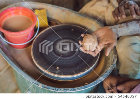 Boy doing ceramic pot in pottery workshop 54546357