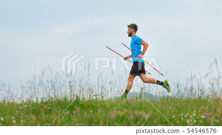 Mountain runner during the preparation of a long Mountain runner during the preparation of a long 54546576