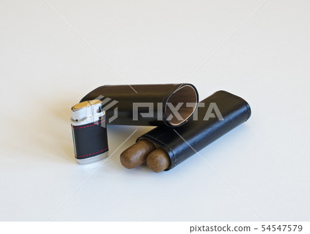 Still life with a cigar lighter and a leather case Still life with a cigar lighter and a leather case 54547579