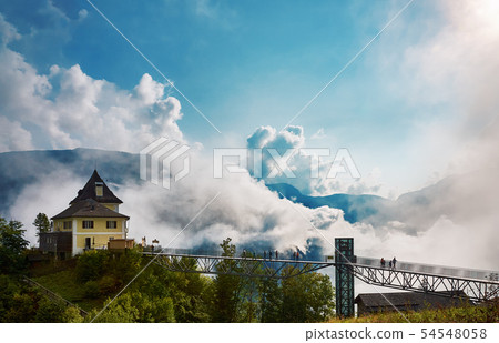 View of the building, mountains and forest at the 54548058