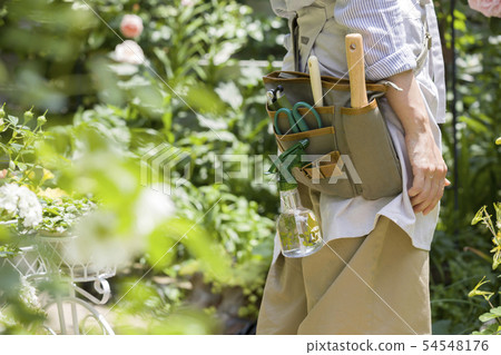 Woman gardening image gardening porch faceless 54548176