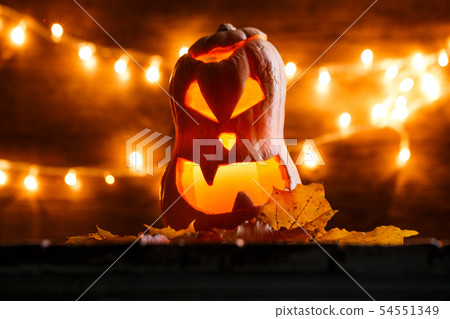 Photo of halloween pumpkin cut in shape of face 54551349