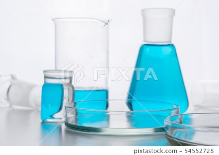 Chemistry glassware with blue liquid. 54552728