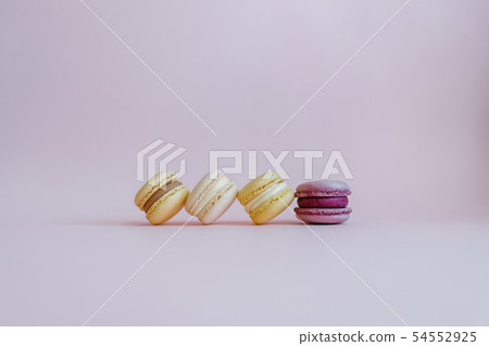 Color tasty macarons on the pink background. Color tasty macarons on the pink background. 54552925