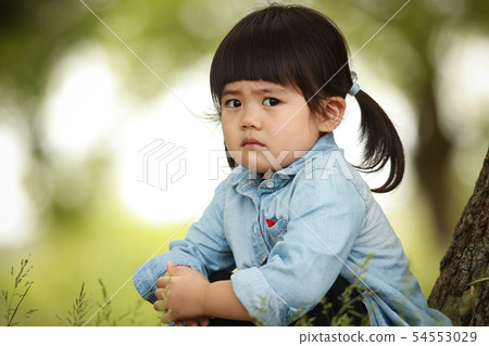 A girl with a sad expression A girl with a sad expression 54553029