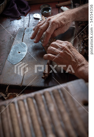 Cigar rolling or making by torcedor in cuba 54554356