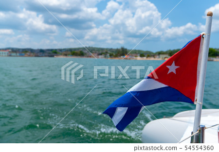 Cuba flag waving on boat at sea near Cuban 54554360
