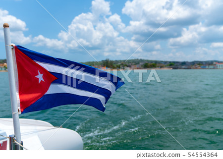 Cuba flag waving on boat at sea near Cuban 54554364