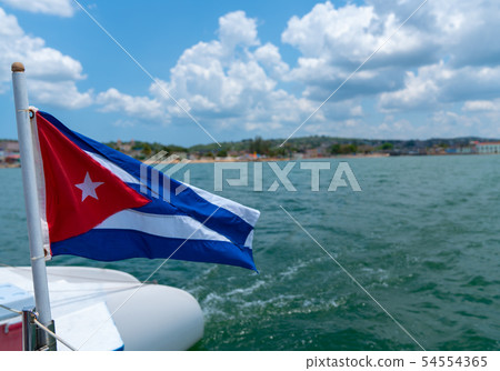 Cuba flag waving on boat at sea near Cuban 54554365