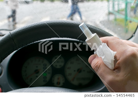 Driver holds a spray from a runny nose 54554465
