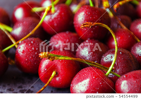 Close up of fresh cherry berries with water drops. Close up of fresh cherry berries with water drops. 54554499