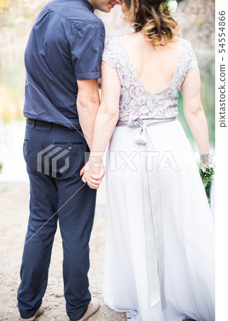 Elegant gentle stylish groom and bride near river Elegant gentle stylish groom and bride near river 54554866