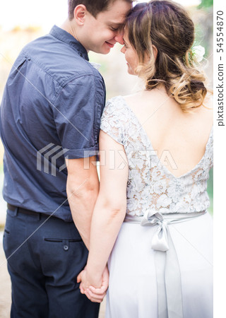 Elegant gentle stylish groom and bride near river Elegant gentle stylish groom and bride near river 54554870