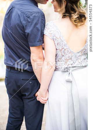 Elegant gentle stylish groom and bride near river Elegant gentle stylish groom and bride near river 54554873