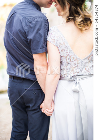 Elegant gentle stylish groom and bride near river Elegant gentle stylish groom and bride near river 54554874