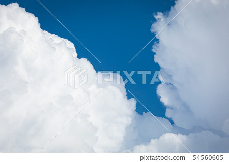 Rising storm cloud and blue sky in sunshine 54560605