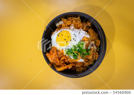 Korean food - Kimchi rice with egg on yellow Korean food - Kimchi rice with egg on yellow 54560900