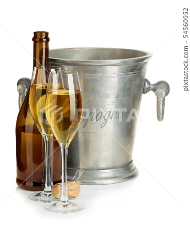 Champagne bottle with ice bucket and glasses. Champagne bottle with ice bucket and glasses. 54560952