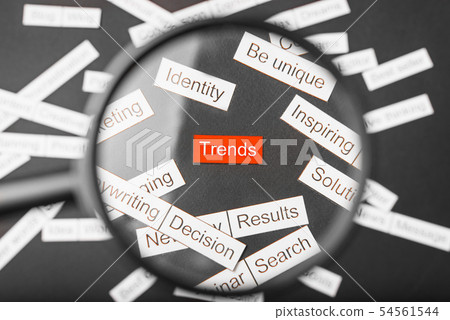 Magnifier glass over the red inscription trends 54561544