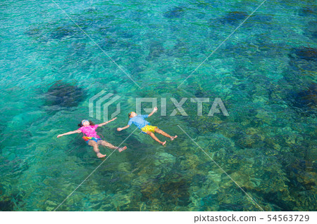Kids snorkel. Children snorkeling in tropical sea. Kids snorkel. Children snorkeling in tropical sea. 54563729