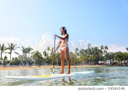 Hawaii beach lifestyle woman paddleboarding Hawaii beach lifestyle woman paddleboarding 54564146