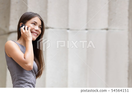 Business woman lawyer talking on smartphone Business woman lawyer talking on smartphone 54564151