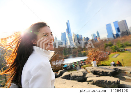 Woman in Central park, New York City Woman in Central park, New York City 54564198