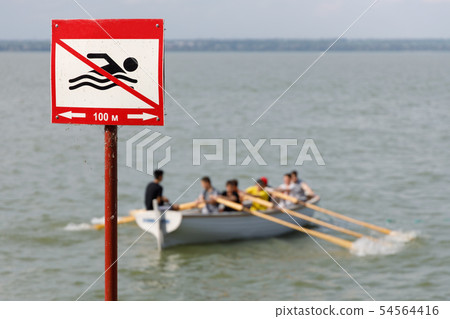 Sign prohibiting swimming in this place 54564416