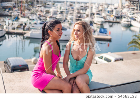 Happy best friends or sisters posing and showing lovely relationship Happy best friends or sisters posing and showing lovely relationship 54565158