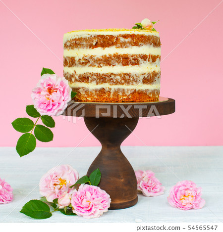Fresh holiday naked cake with cream and pink roses 54565547