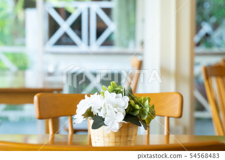 Wooden table and chair in the coffee shop cafe. Wooden table and chair in the coffee shop cafe. 54568483