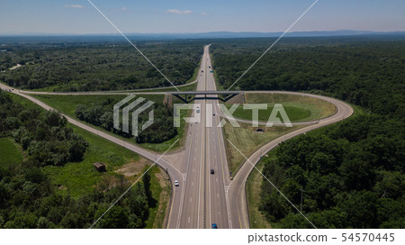 Aerial view of highway cloverleaf interchange seen from above. Aerial view of highway cloverleaf interchange seen from above. 54570445