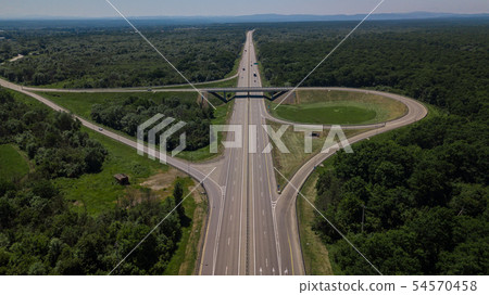 Aerial view of highway cloverleaf interchange seen from above. 54570458