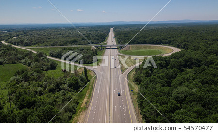 Aerial view of highway cloverleaf interchange seen from above. Aerial view of highway cloverleaf interchange seen from above. 54570477