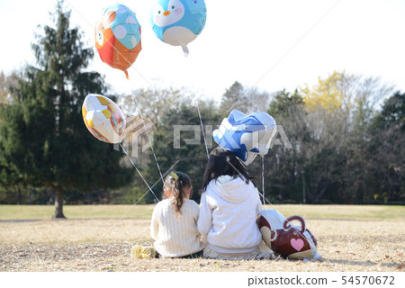 Back view of a child sitting in the park 54570672