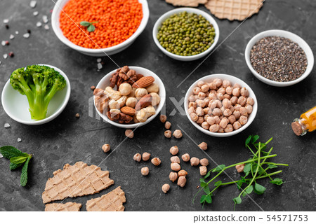 Healthy vegan food on a concrete background Healthy vegan food on a concrete background 54571753