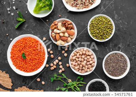 Healthy vegan food on a concrete background Healthy vegan food on a concrete background 54571761